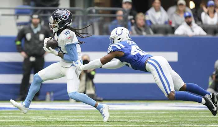 Indianapolis Colts linebacker E.J. Speed (45) dives after Tennessee Titans wide receiver DeAndre Hopkins (10) as he rushes the ball in the game Lucas Oil Stadium at Lucas Oil Stadium.